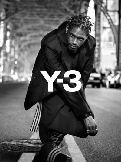 A$AP Nast poses under a New York City bridge wearing Y-3 apparel and footwear.